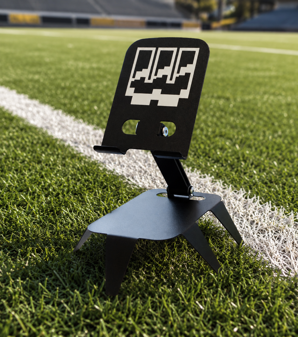 workplay claw of density device stand lifestyle image on field