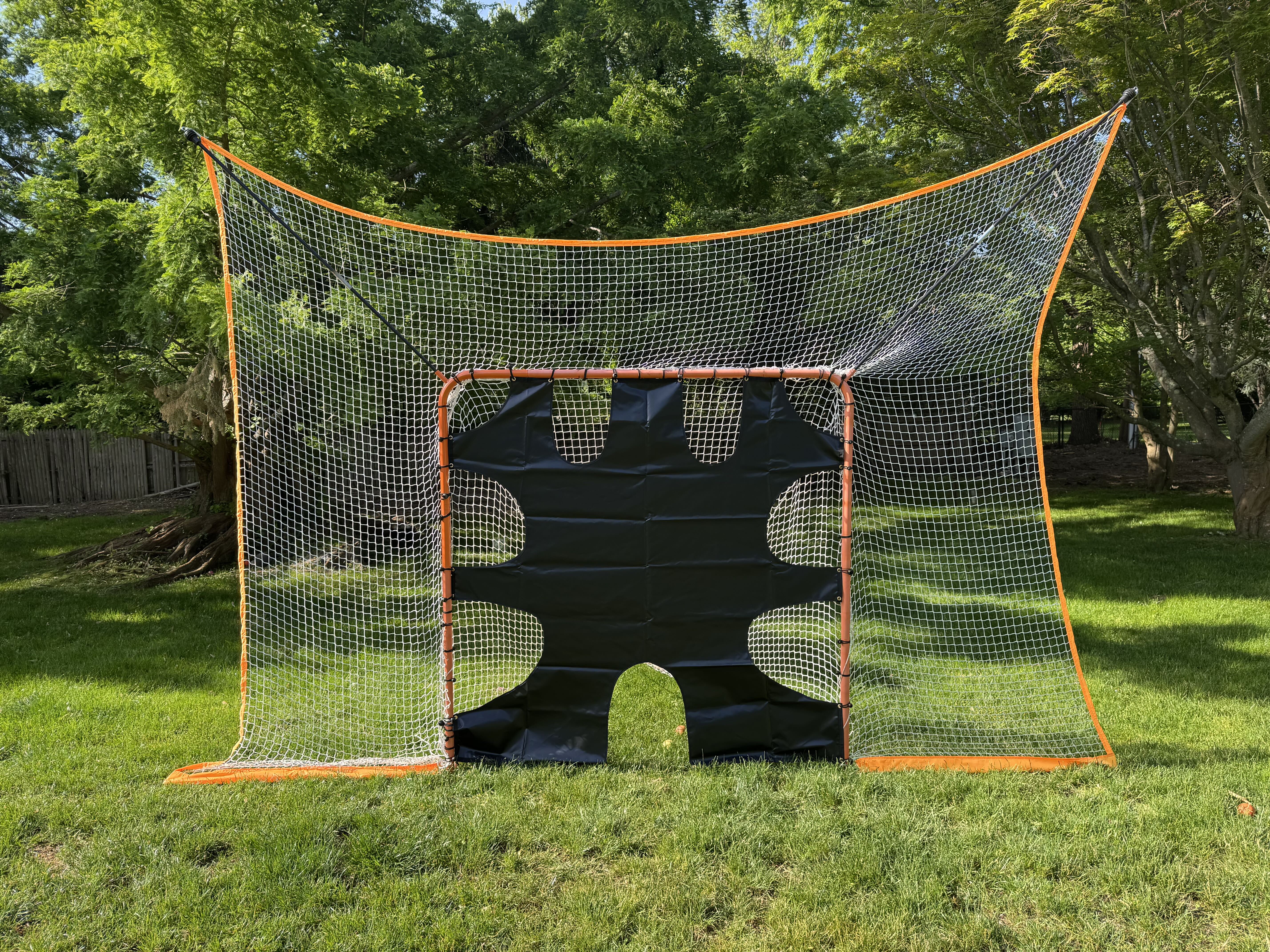 lacrosse goal net with removable black goal shield front view on grass