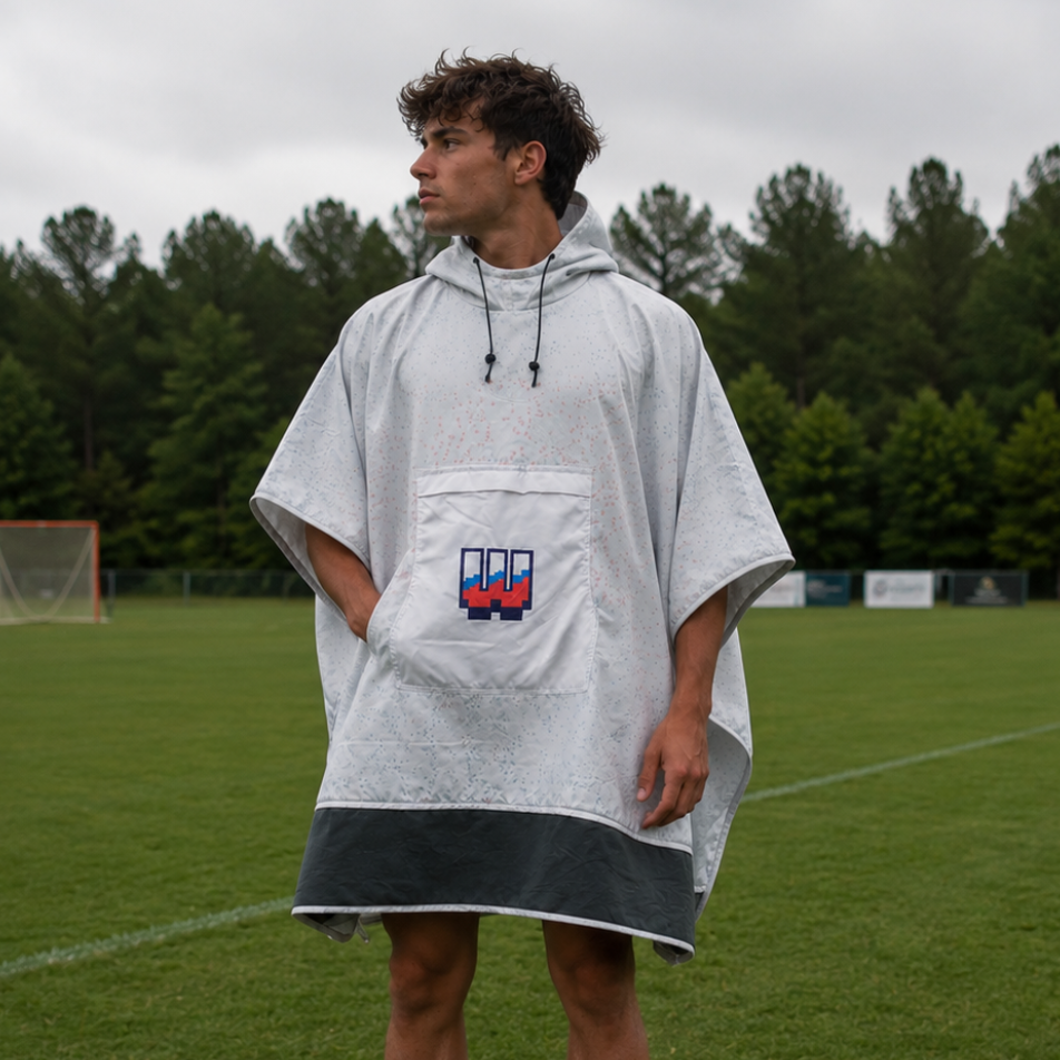 Athlete wearing Workplay Fallball Poncho on lacrosse field